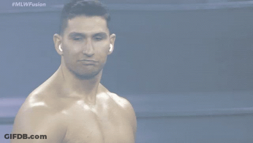 A Shirtless Man Stands In Front Of A Screen That Says #Mlwfusion GIF