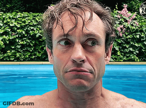 A Shirtless Man Stands In Front Of A Swimming Pool With A Sign That Says The 24 On It GIF