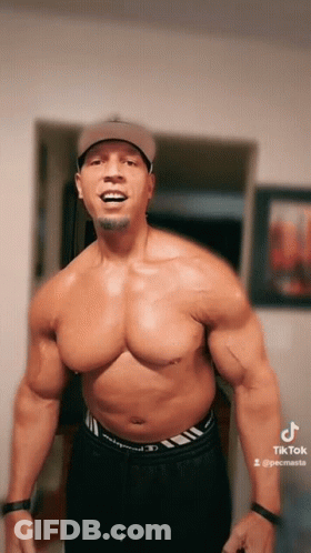 A Shirtless Man Wearing A Baseball Cap And Black Shorts Has A Tiktok Account GIF
