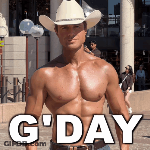 A Shirtless Man Wearing A Cowboy Hat Stands In Front Of A Sign That Says G'day GIF