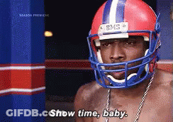 A Shirtless Man Wearing A Football Helmet Says " Show Time Baby " GIF