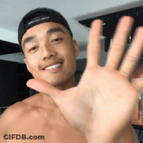 A Shirtless Man Wearing A Hat That Says Miss Usa On It Waves His Hand GIF