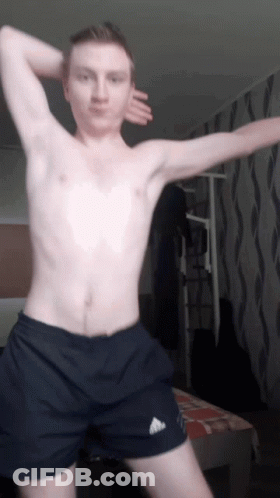 A Shirtless Man Wearing Black Adidas Shorts Is Dancing GIF