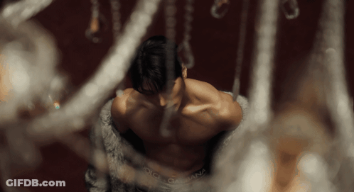 A Shirtless Man Wearing Dolce & Gabbana Underwear Looks Down GIF