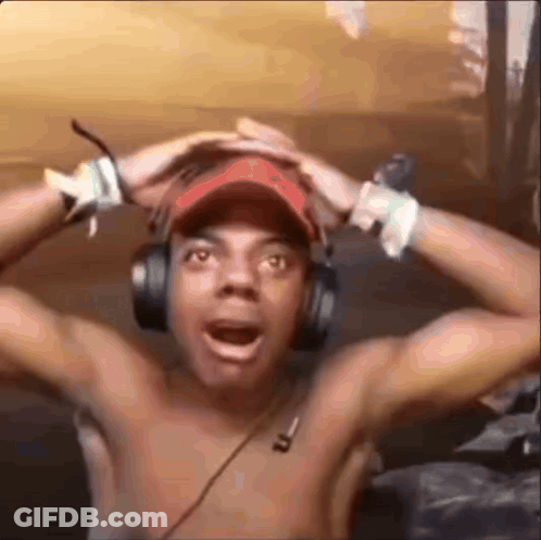 A Shirtless Man Wearing Headphones And A Baseball Cap Is Making A Funny Face . GIF