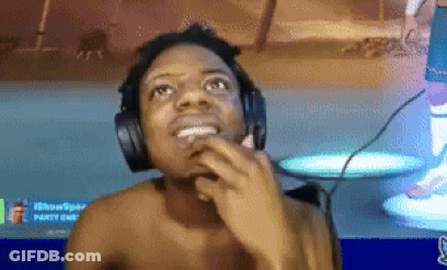 A Shirtless Man Wearing Headphones And A Microphone Is Looking Up . GIF