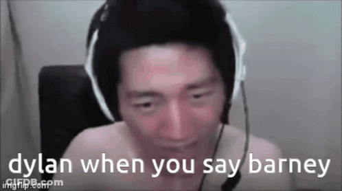 A Shirtless Man Wearing Headphones And A Microphone Is Talking To Someone . GIF
