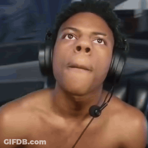 A Shirtless Man Wearing Headphones And A Microphone Making A Funny Face GIF