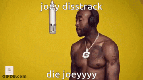A Shirtless Man Wearing Headphones Stands In Front Of A Microphone With The Words Joey Disstrack Die Joeyyyy GIF