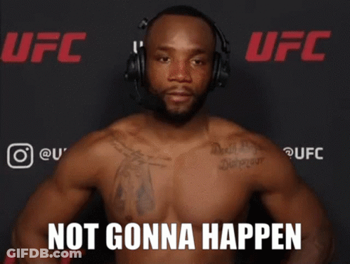 A Shirtless Man Wearing Headphones Stands In Front Of A Ufc Banner GIF