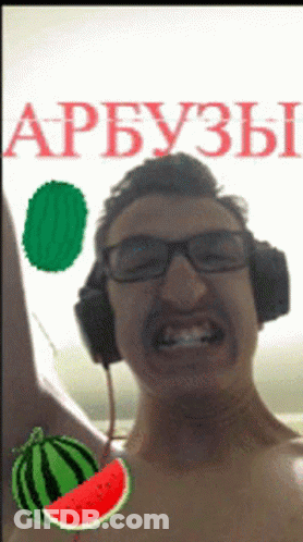 A Shirtless Man Wearing Headphones With A Watermelon In Front Of Him GIF
