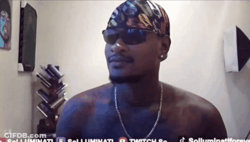 A Shirtless Man Wearing Sunglasses And A Bandana Has The Hashtag Solluminati On The Bottom Right GIF