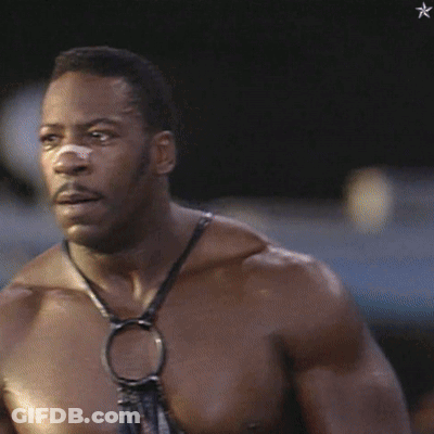 A Shirtless Man With A Bandage On His Nose Looks To The Side GIF