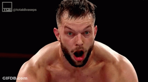 A Shirtless Man With A Beard Is Making A Funny Face With His Mouth Open . GIF