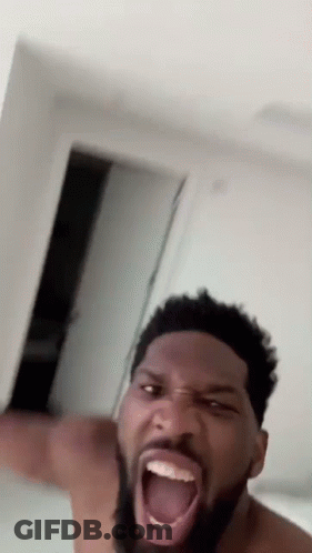 A Shirtless Man With A Beard Is Making A Funny Face GIF
