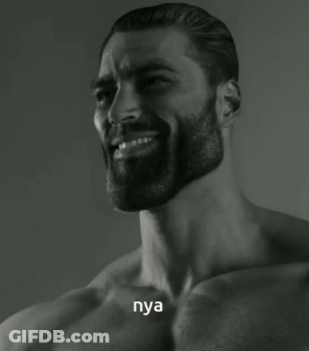 A Shirtless Man With A Beard Is Smiling And The Word Nya Is On His Chest GIF