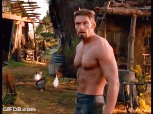 Shirtless Man With Beard In Front Of Chicken Coop GIF