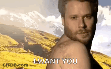 A Shirtless Man With A Beard Is Standing In Front Of A Mountain And Says `` I Want You '' . GIF