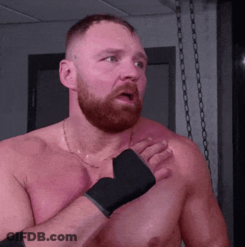 A Shirtless Man With A Beard Is Wearing Boxing Gloves On His Hands GIF