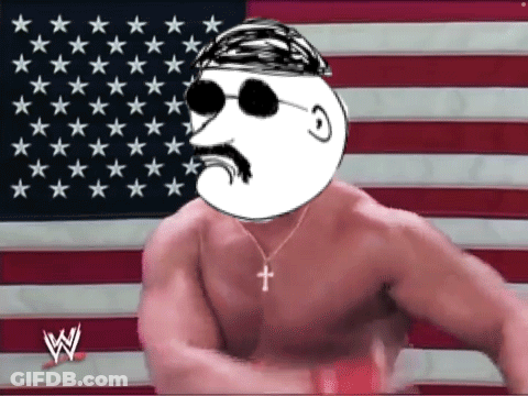 A Shirtless Man With A Cross Necklace Stands In Front Of An American Flag With Stars GIF