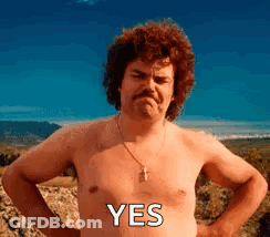 A Shirtless Man With A Mustache Is Standing With His Hands On His Hips And The Word Yes On His Chest . GIF