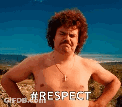 A Shirtless Man With A Mustache Is Standing With His Hands On His Hips And The Words `` Respect '' Written On His Chest GIF