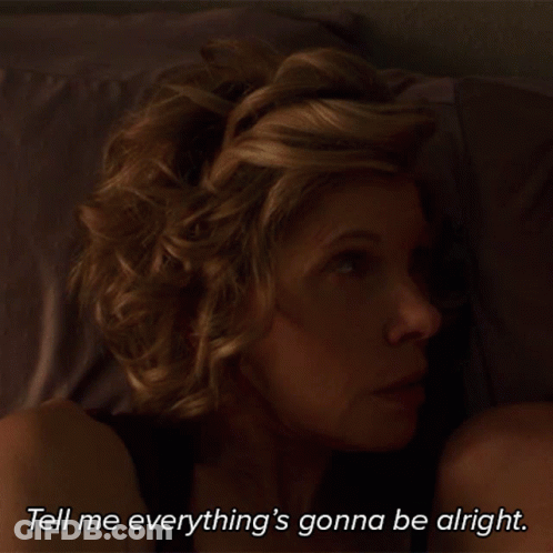 A Shirtless Man With A Mustache Says " Everything 'S Gonna Be Alright " In A Dark Room GIF