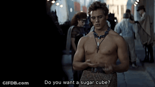 A Shirtless Man With A Necklace Says Do You Want A Sugar Cube GIF