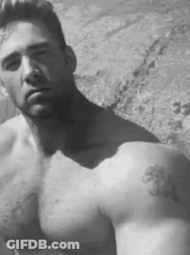 A Shirtless Man With A Tattoo On His Arm GIF