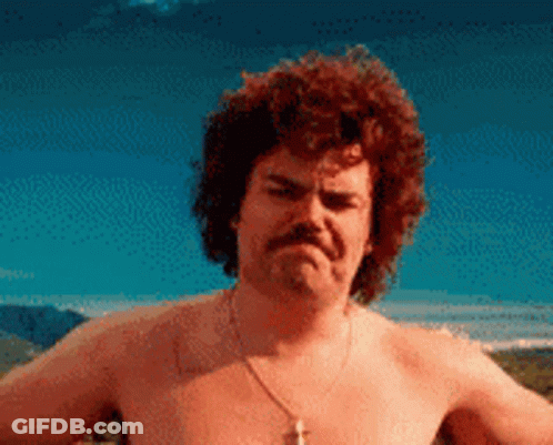 A Shirtless Man With Curly Hair And A Mustache Is Making An Angry Face GIF
