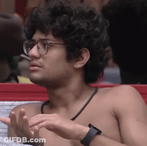Shirtless Man With Curly Hair Glasses And Watch GIF