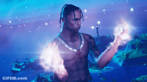 A Shirtless Man With Dreadlocks And A Necklace With A Cross On It GIF