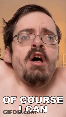 A Shirtless Man With Glasses And A Beard Has The Words Of Course I Can On His Face GIF