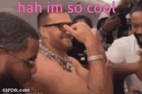 A Shirtless Man With Glasses And A Chain Around His Neck Says ' Hah Im So Cool ' In Pink GIF