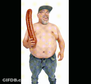 A Shirtless Man With Glasses And A Hat Is Holding A Long Sausage GIF
