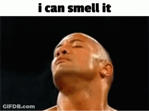 A Shirtless Man With His Eyes Closed And The Words " I Can Smell It " Below Him GIF