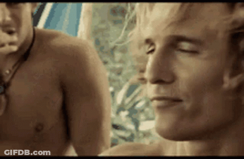 A Shirtless Man With His Eyes Closed Is Standing Next To Another Shirtless Man With His Eyes Closed . GIF