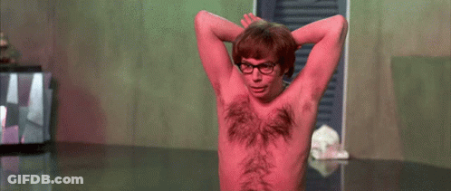 A Shirtless Man With Red Hair On His Chest And Glasses GIF