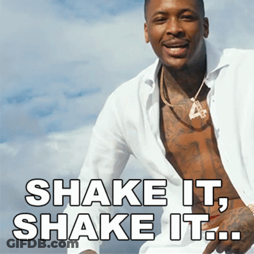 A Shirtless Man With The Words Shake It Shake It Written Below Him GIF