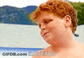 A Shirtless Red Haired Boy Says I Love You In Front Of A Body Of Water GIF