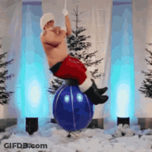 A Shirtless Santa Claus Is Balancing On A Blue Ornament GIF