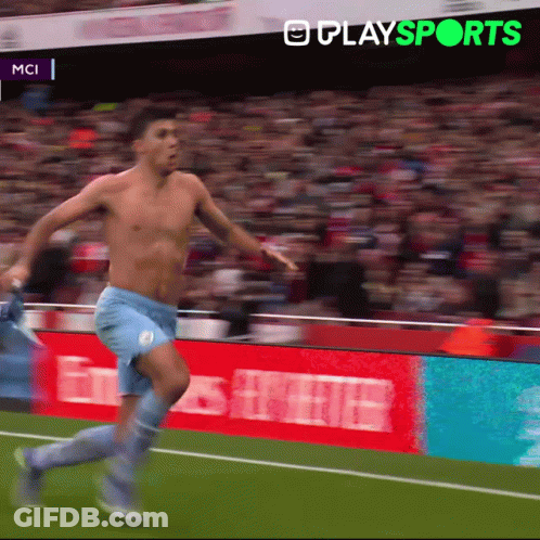 A Shirtless Soccer Player Is Running On A Field With A Playsports Logo In The Background GIF