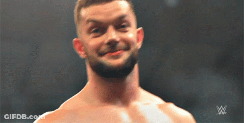 A Shirtless Wrestler Is Smiling In Front Of A Wwe Logo GIF