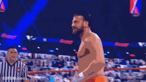 A Shirtless Wrestler Is Standing In A Ring With A Referee Behind Him GIF
