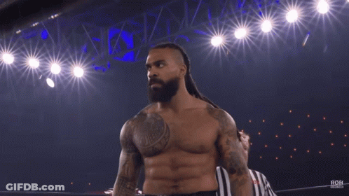 A Shirtless Wrestler Is Standing In A Ring With The Word Roh On The Bottom GIF