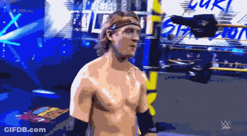 A Shirtless Wrestler Is Standing In Front Of A Sign That Says ' Smack Down ' GIF
