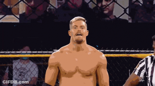 A Shirtless Wrestler Stands In Front Of A Referee In A Cage With The Hashtag # 2K20live GIF