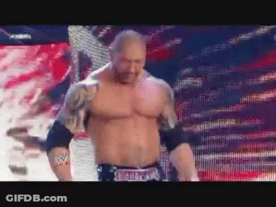 A Shirtless Wrestler With A Belt That Says Batista GIF