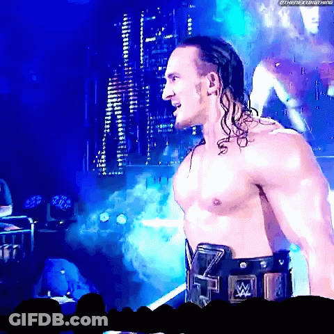 A Shirtless Wrestler With A Wrestling Belt That Says ' Tna ' On It GIF