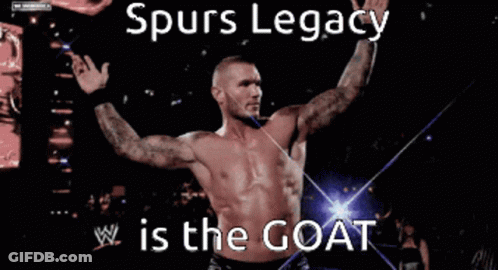 A Shirtless Wrestler With The Words Spurs Legacy Is The Goat On The Bottom GIF